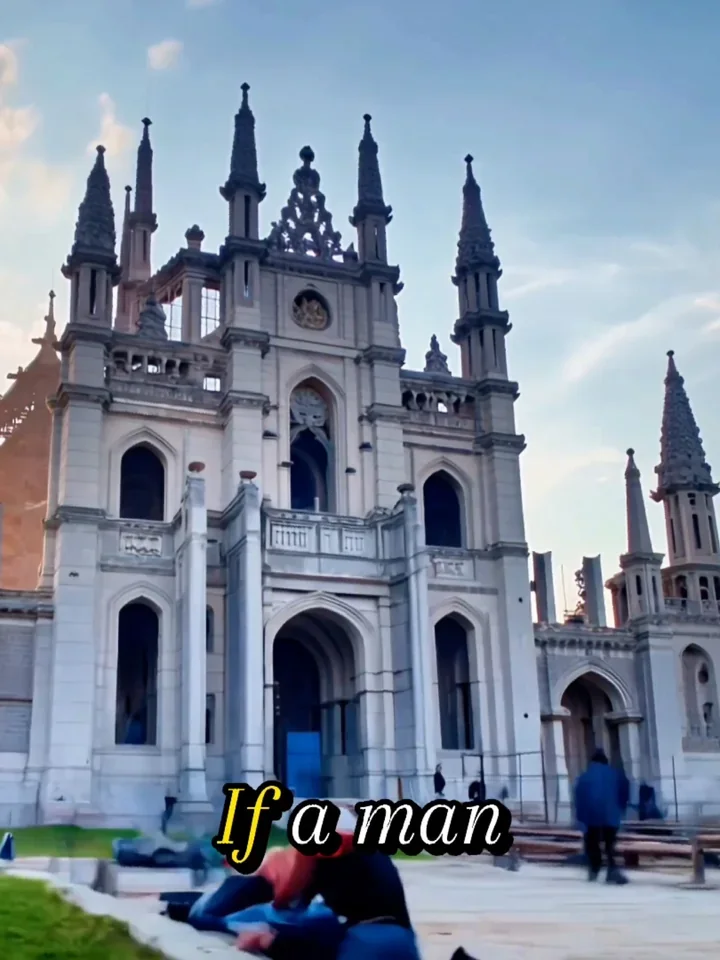 A white church with ornate towers beneath a blue sky.